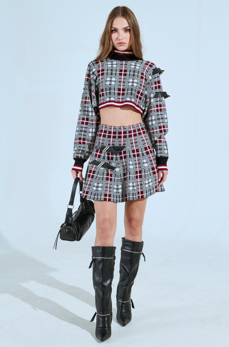 ALL EYES ON ME BUCKLE DETAIL KNIT MINI SKIRT IN RED