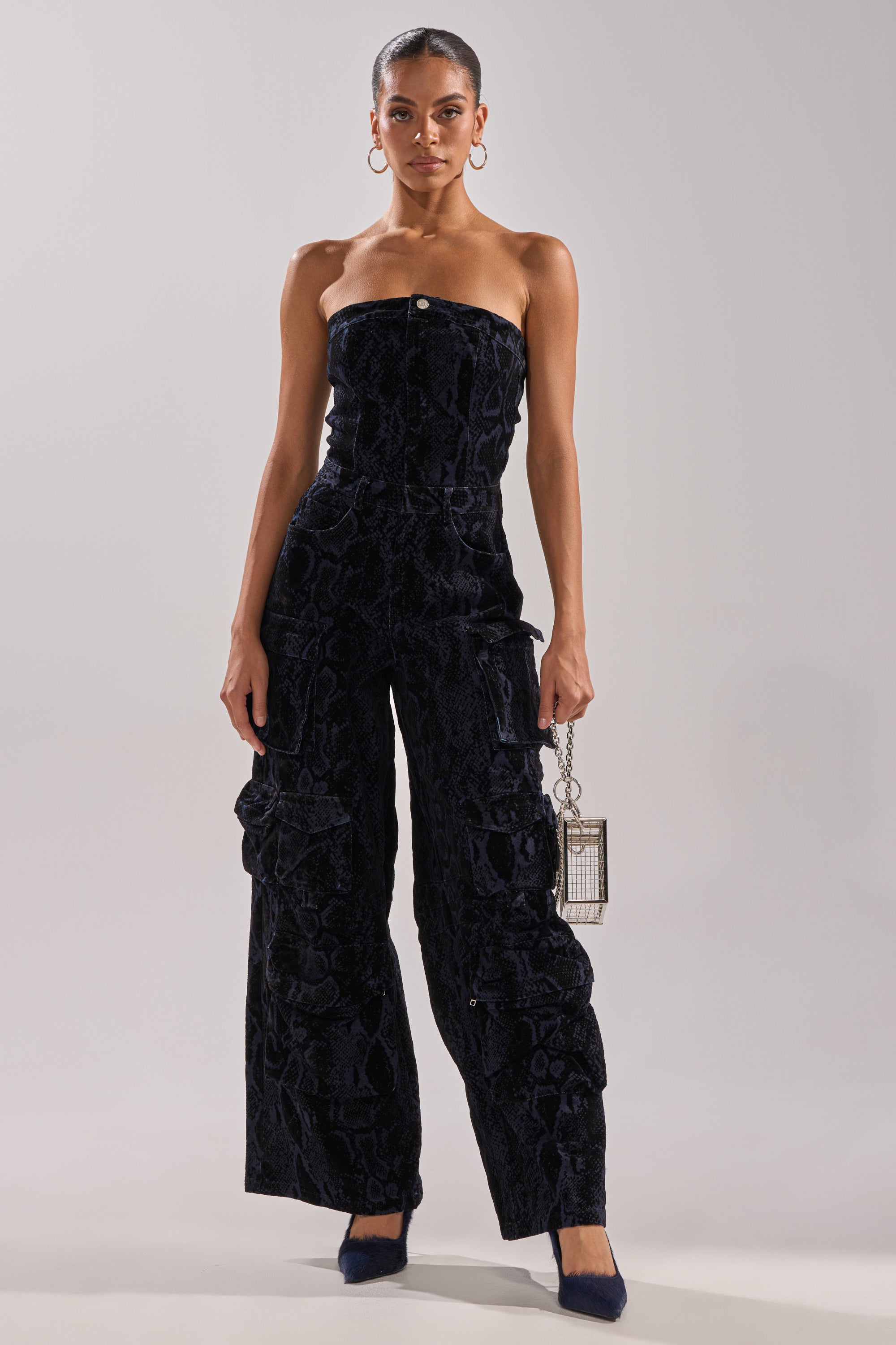 CAUGHT YOUR EYE VELVET DENIM JUMPSUIT IN SNAKEPRINT